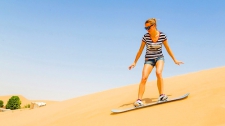 Guided Desert Safari with Dune-Bashing, Sandboarding & Falcon Experience